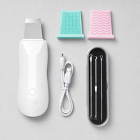 Kit completo: espátula, cable USB, almohadillas y accesorios